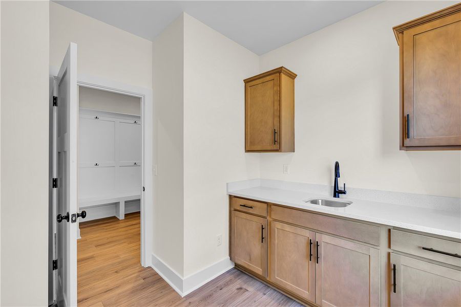 Laundry Room with sink and extra cabinets