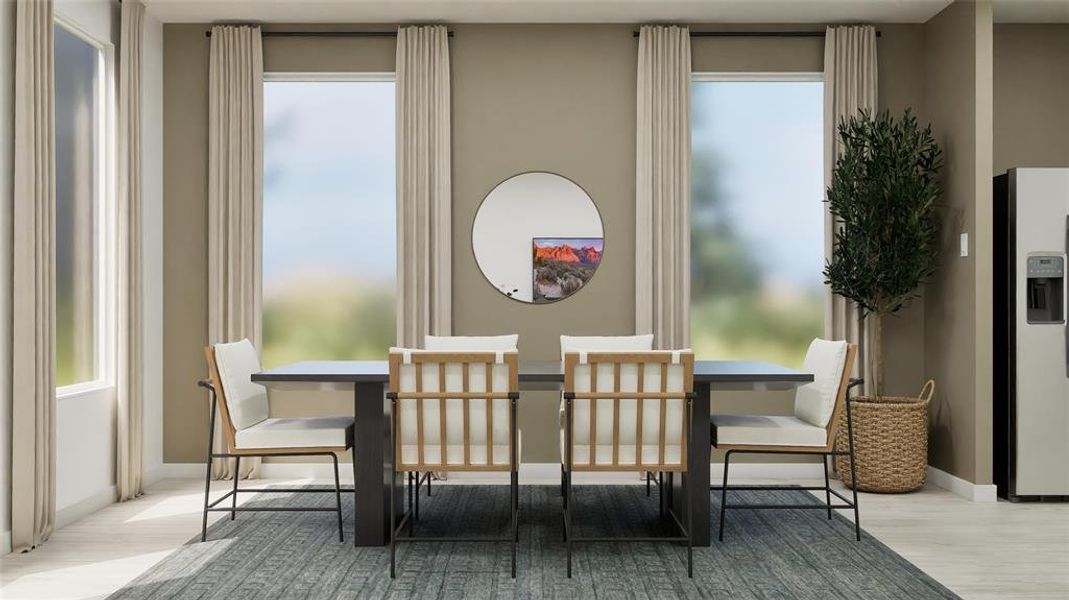 Dining area featuring baseboards and light wood-style flooring