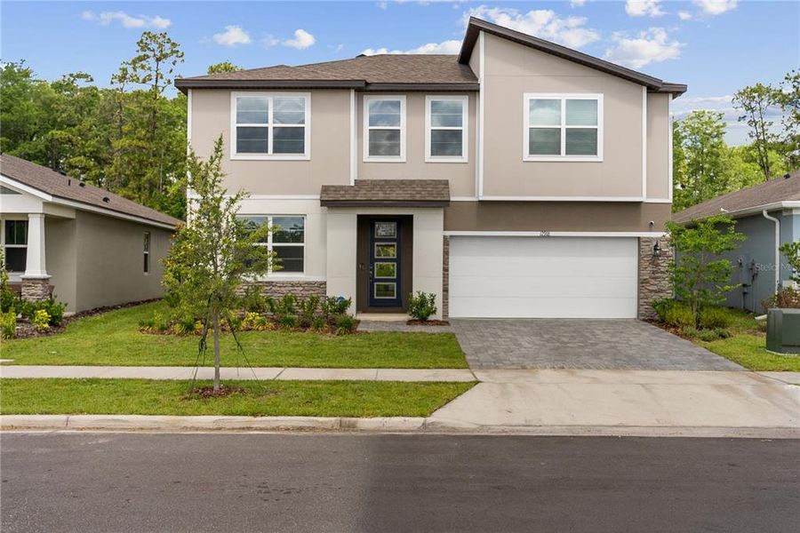 Front exterior of a new home in Meridian Parks, Orlando, FL, highlighting curb appeal (Image 2). Front exterior of a new home in Meridian Parks, Orlando, FL, highlighting curb appeal (Image 2).