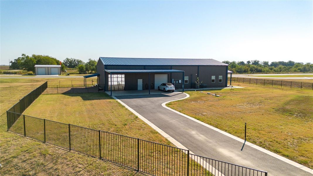 Enjoy private driveway and access to the hangar-home. Enjoy private driveway and access to the hangar-home.