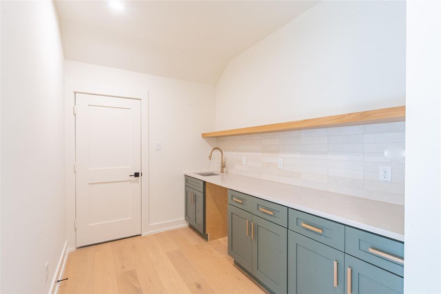 Top floor room offers ample storage and utility sink Top floor room offers ample storage and utility sink