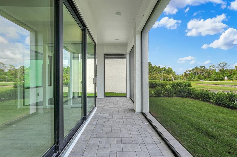 Exterior details and patio area of a home in Hampton Green at Providence, Davenport (Image 35).