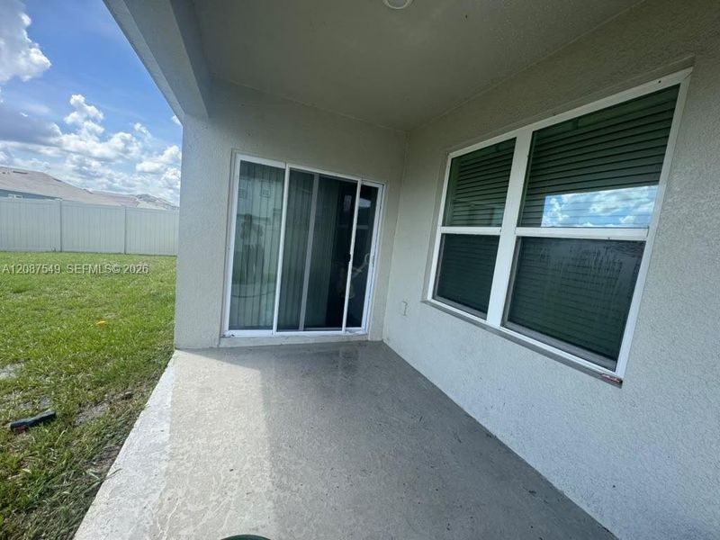 Exterior details and patio area of a home in Villamar by Express Homes, Winter Haven (Image 4).