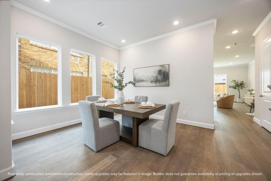 From another angle, the dining room reveals its generous proportions, ready to host your gatherings with grace and doors that open to welcome you home. From another angle, the dining room reveals its generous proportions, ready to host your gatherings with grace and doors that open to welcome you home.