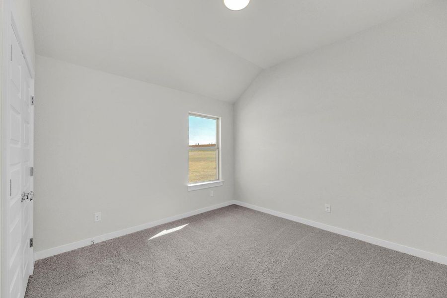 Bedroom in the Pecos home plan by Trophy Signature Homes – REPRESENTATIVE PHOTO