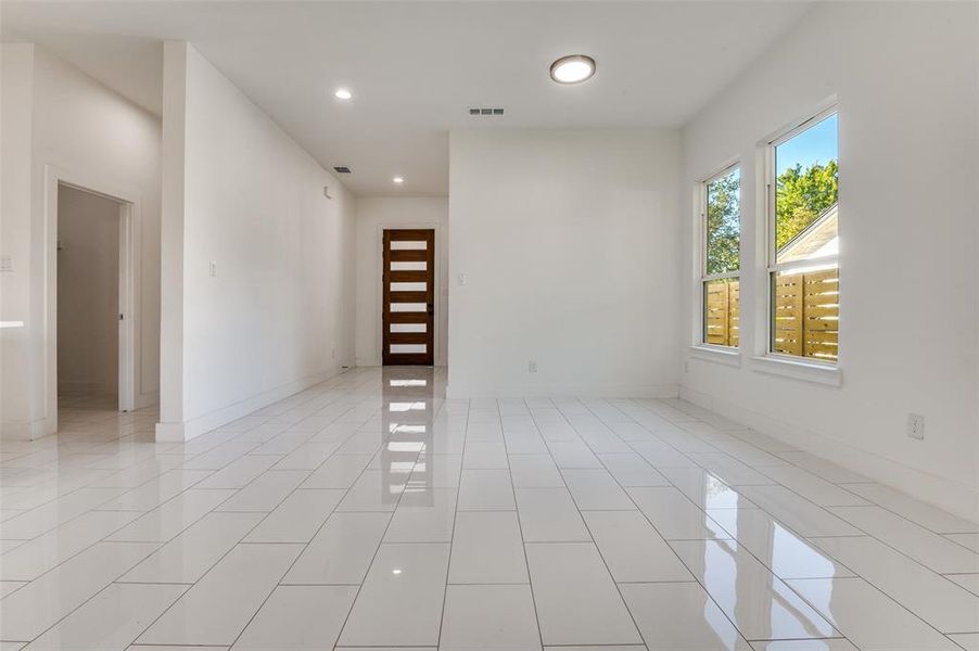 Unfurnished room featuring recessed lighting and light tile patterned floors
