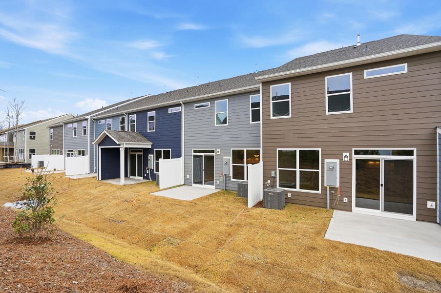 Exterior details and patio area of a home in Harrisburg Village Townhomes, Harrisburg (Image 4).