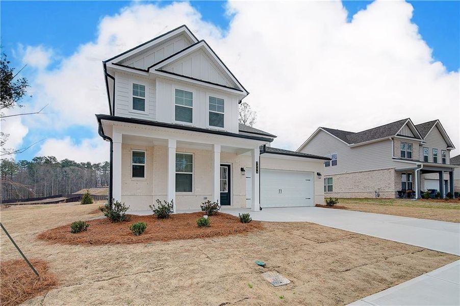Front exterior of a new home in Hamilton Lakes, Lawrenceville, GA, highlighting curb appeal (Image 18).