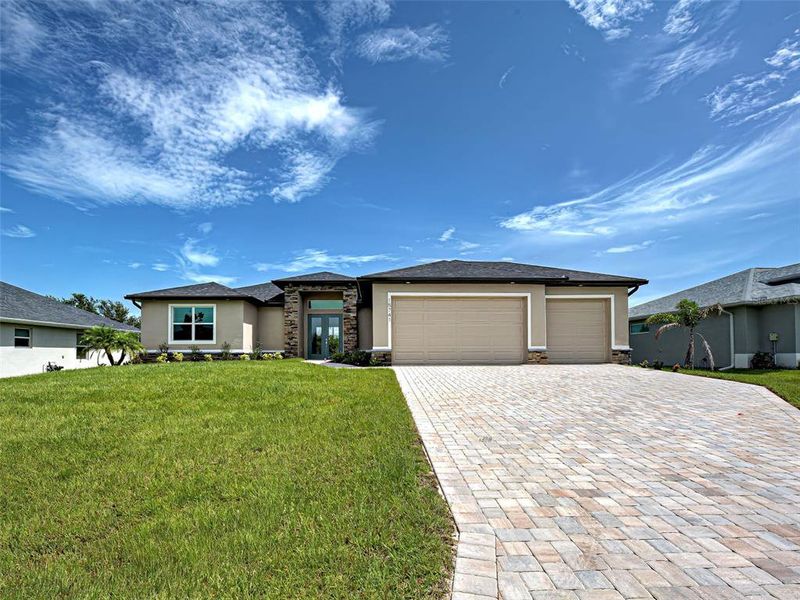 Front exterior of a new home in , Port Charlotte, FL, highlighting curb appeal (Image 14).