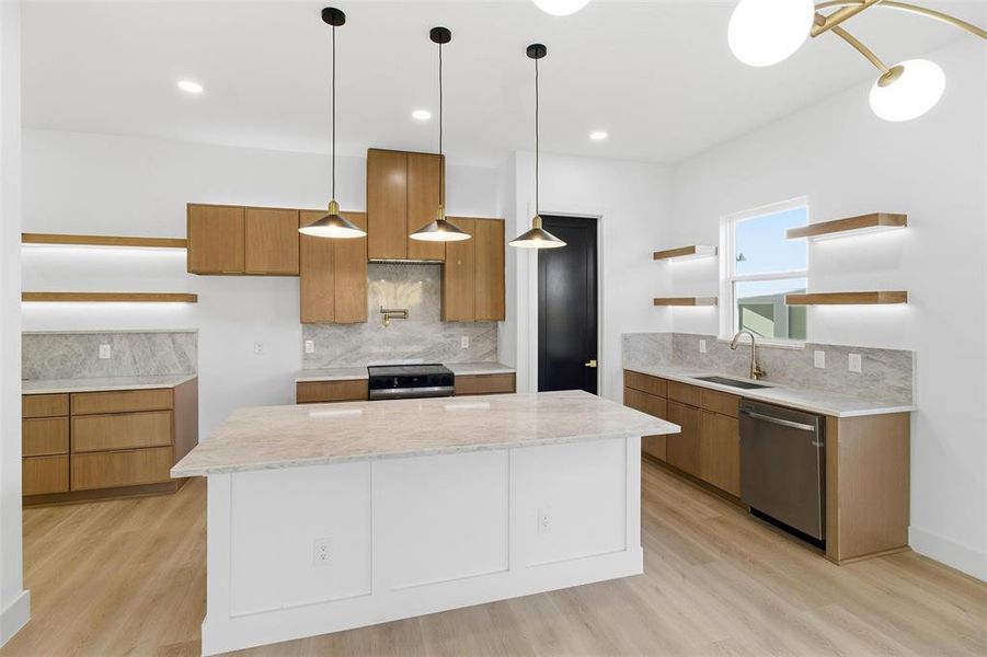 Dual tone kitchen featuring open shelves, backsplash, light stone counters, light wood-type flooring, and two tone color scheme