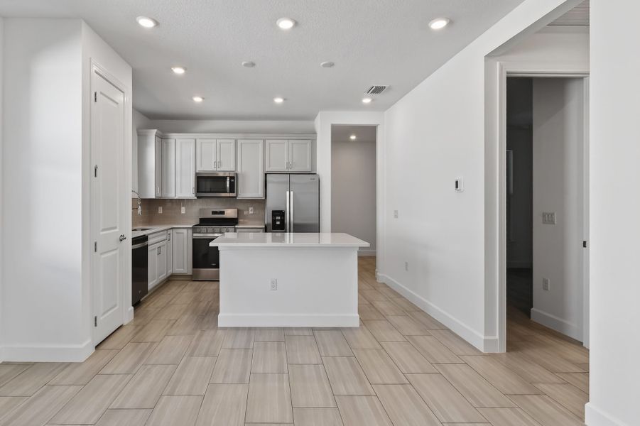 Furnished interior view inside a new home in Costa Pointe, Vero Beach (Image 17).