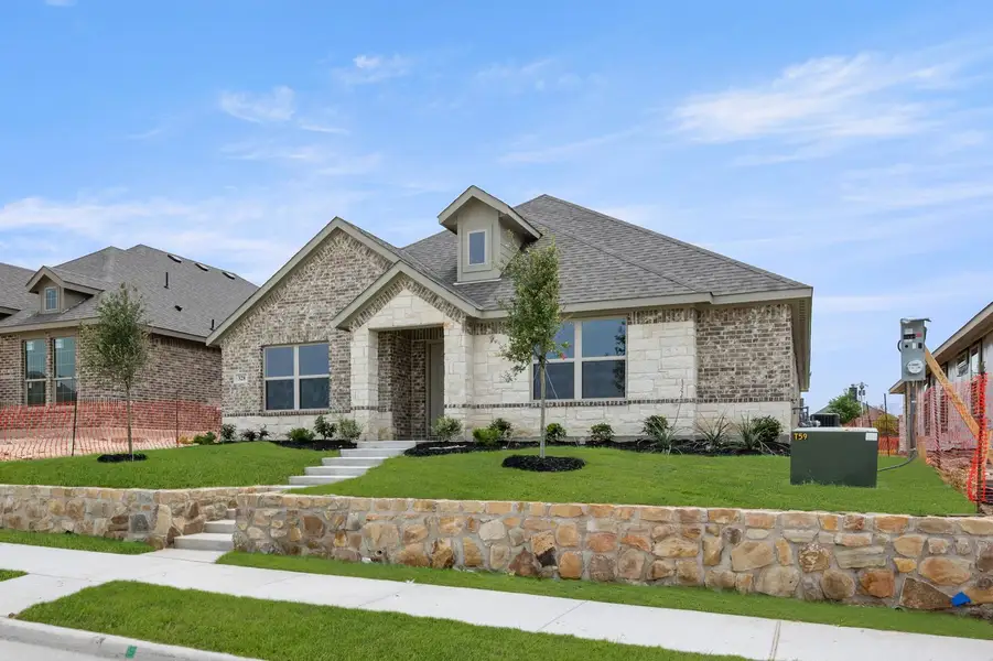 Front exterior of a new home in Redden Farms, Midlothian, TX, highlighting curb appeal (Image 2). Front exterior of a new home in Redden Farms, Midlothian, TX, highlighting curb appeal (Image 2).