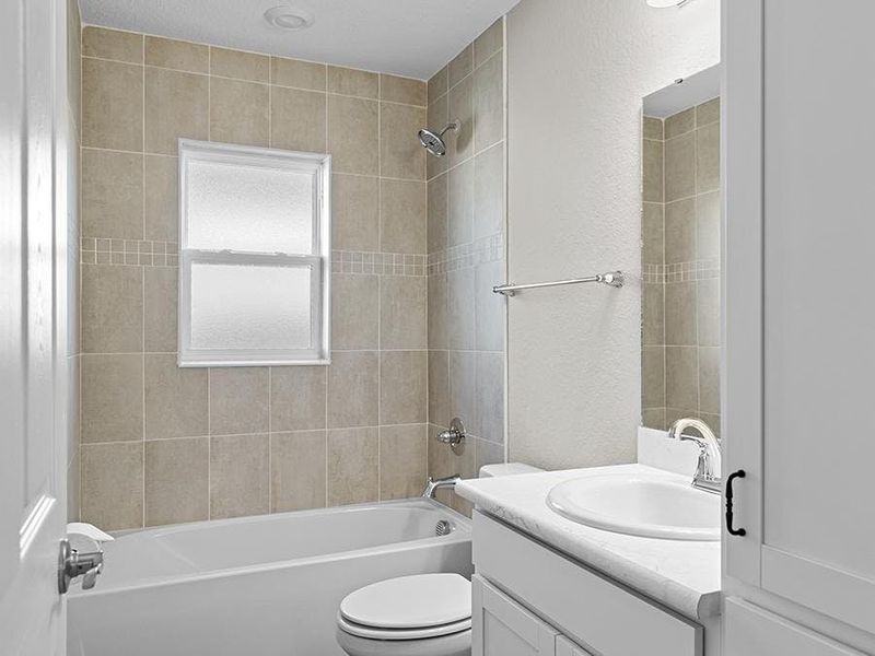 Secondary bedrooms share a convenient hall bath.