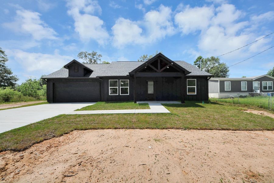 Front exterior of a new home in , Cleveland, TX, highlighting curb appeal (Image 20).