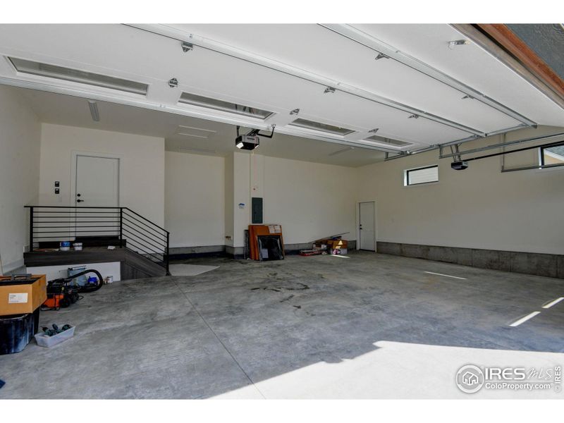 Spacious and finished 3 car garage with transom windows increasing the finished space