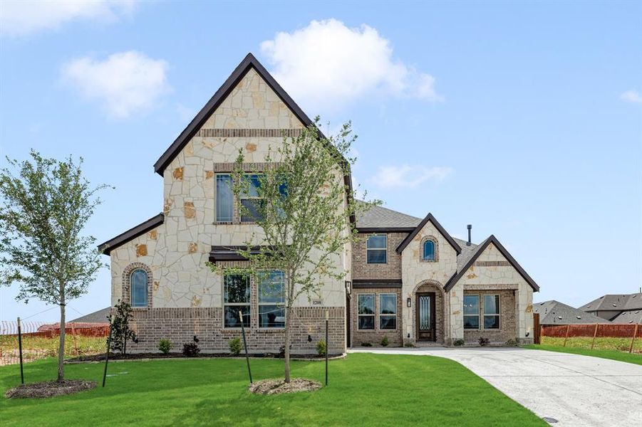 Front exterior of a new home in The Oaks, Red Oak, TX, highlighting curb appeal (Image 25). Front exterior of a new home in The Oaks, Red Oak, TX, highlighting curb appeal (Image 25).