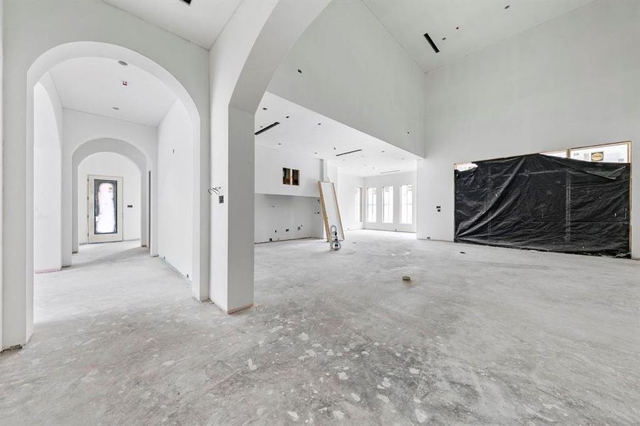 View from the first open hallway between your grand living room and the first private downstairs bedroom or office.