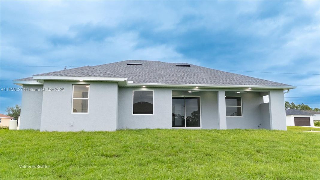 Front exterior of a new home in , Lehigh Acres, FL, highlighting curb appeal (Image 25).