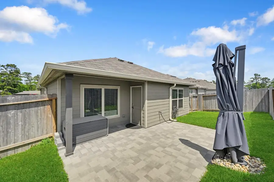 This commercial grade umbrella unfolds to provide shade for this entire patio area. The span of the umbrella is huge!