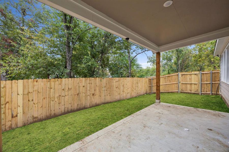 Fenced backyard with a patio Fenced backyard with a patio