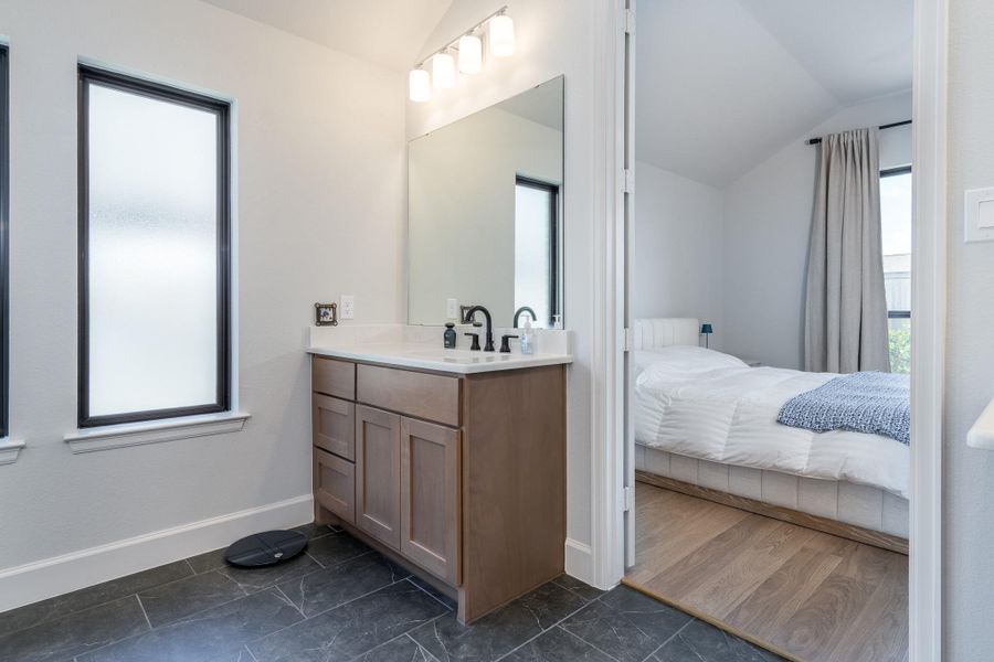 Dual vanities in the primary bath provide counter and storage space for everyone. Dual vanities in the primary bath provide counter and storage space for everyone.