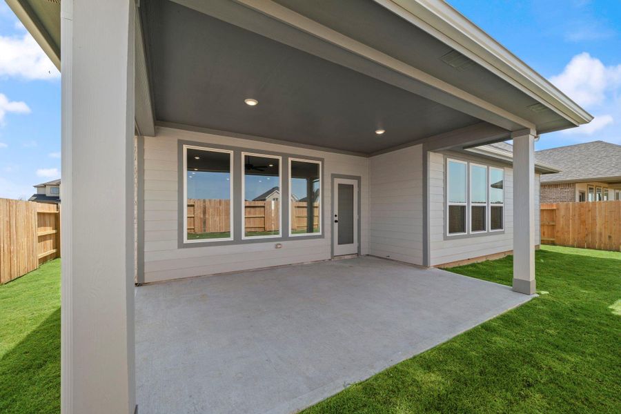 This covered patio isn’t just an extension of your home; it’s a place where you can truly connect with nature and the people you love.