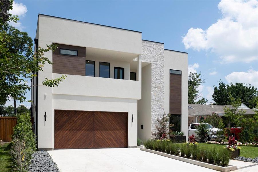 Modern home featuring a garage Modern home featuring a garage