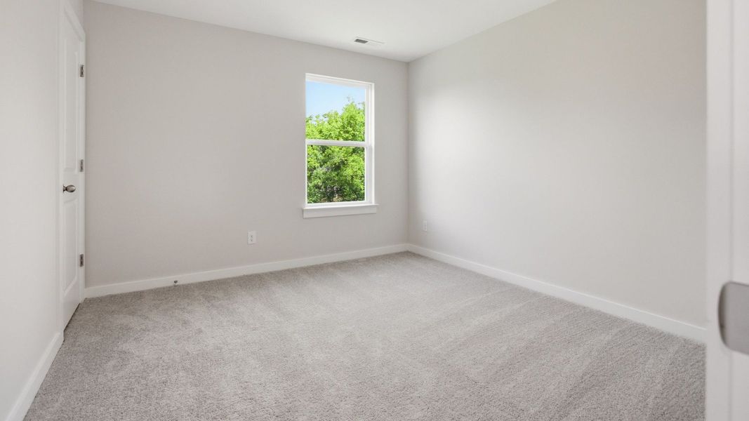 Bedroom with carpet and window Bedroom with carpet and window
