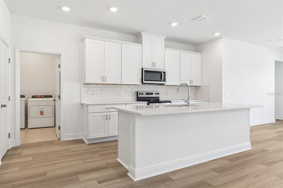 Furnished interior view inside a new home in Cyrene at Minneola - Villas, Minneola (Image 5).
