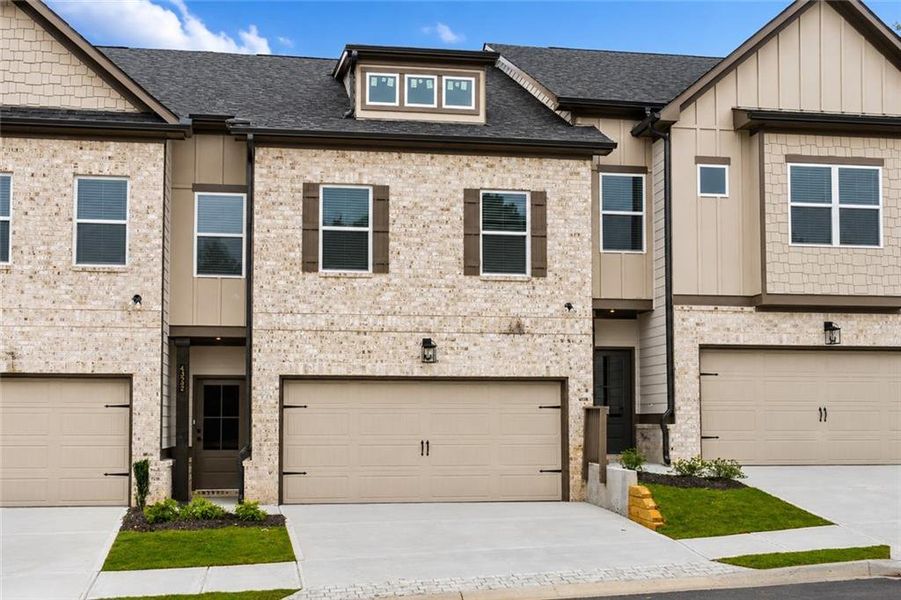 Front exterior of a new home in , Norcross, GA, highlighting curb appeal (Image 1). Front exterior of a new home in , Norcross, GA, highlighting curb appeal (Image 1).