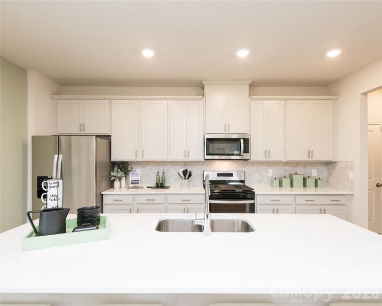 Photo is not of the actual home, but is an inspirational photo of builder’s model home and may depict options, furnishings, and/or decorator features that are not included