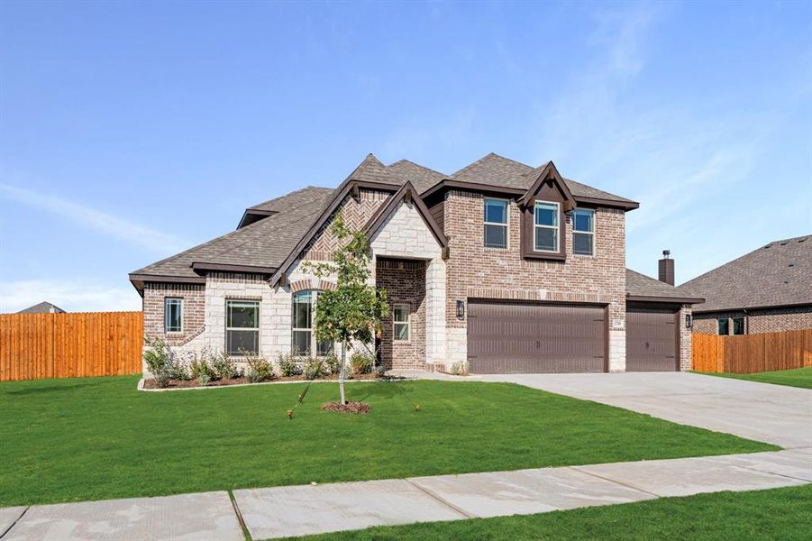 Front exterior of a new home in Coyote Crossing, Godley, TX, highlighting curb appeal (Image 26).