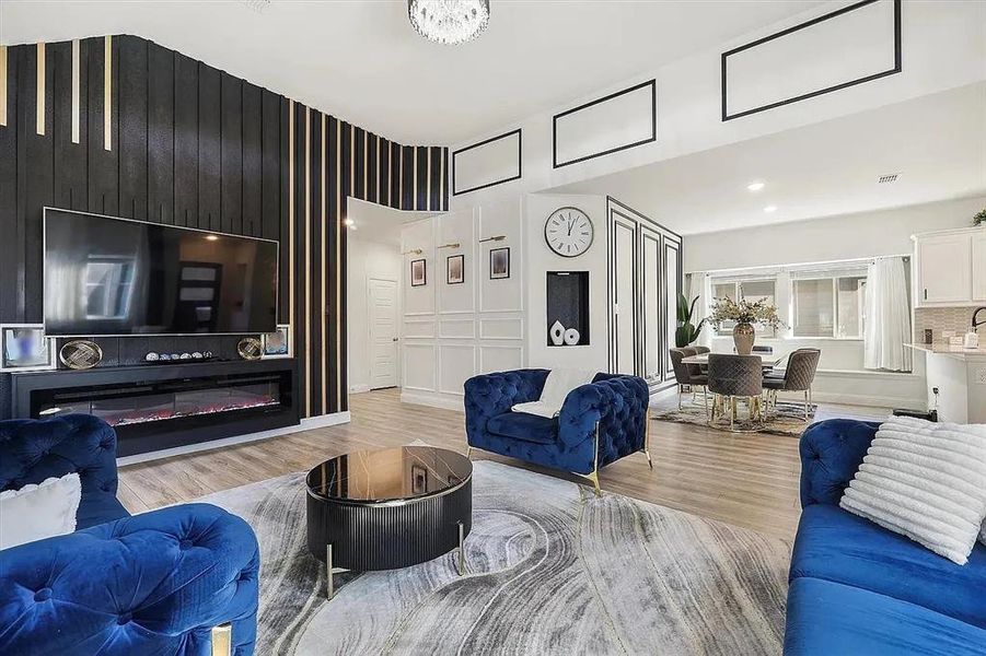 Living room with light hardwood / wood-style floors