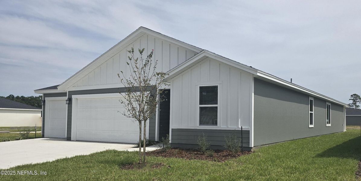 Front exterior of a new home in Azalea Creek, Jacksonville, FL, highlighting curb appeal (Image 17). Front exterior of a new home in Azalea Creek, Jacksonville, FL, highlighting curb appeal (Image 17).