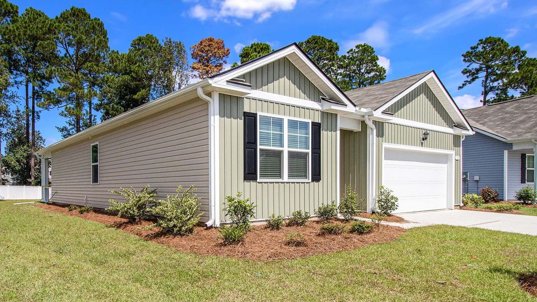 Front exterior of a new home in Preserve at Cypress Commons, Conway, SC, highlighting curb appeal (Image 2). Front exterior of a new home in Preserve at Cypress Commons, Conway, SC, highlighting curb appeal (Image 2).