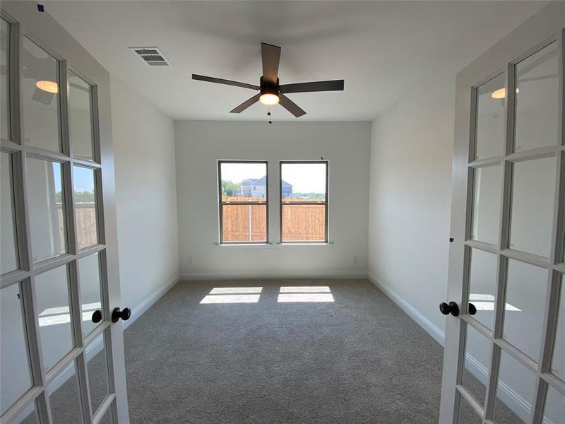 Study with French doors and ceiling fan Study with French doors and ceiling fan