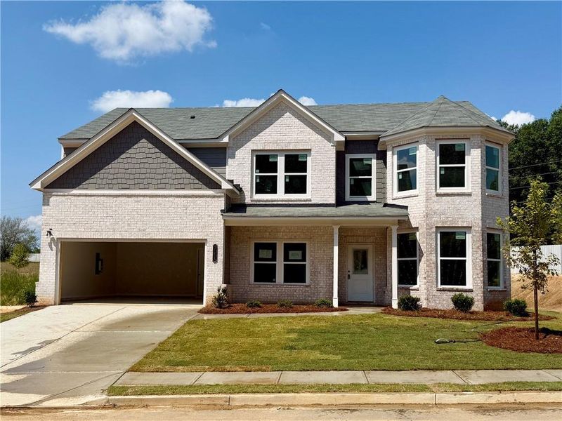 Front exterior of a new home in , Buford, GA, highlighting curb appeal (Image 14).