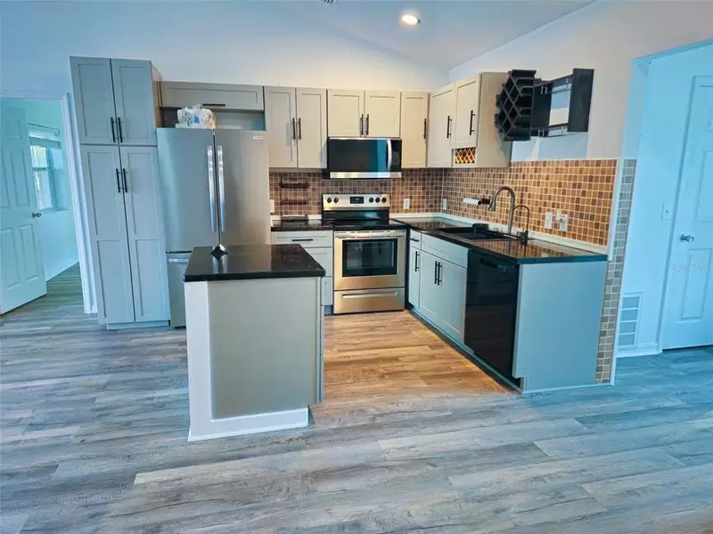 Furnished interior view inside a new home in , Dunnellon (Image 6).