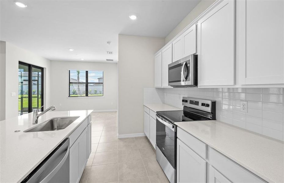 Furnished interior view inside a new home in The Strand at Cedar Grove, North Port (Image 12).