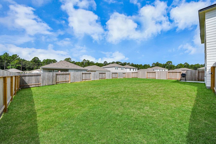 The vast backyard is an empty canvas ready for you to add whatever you desire.