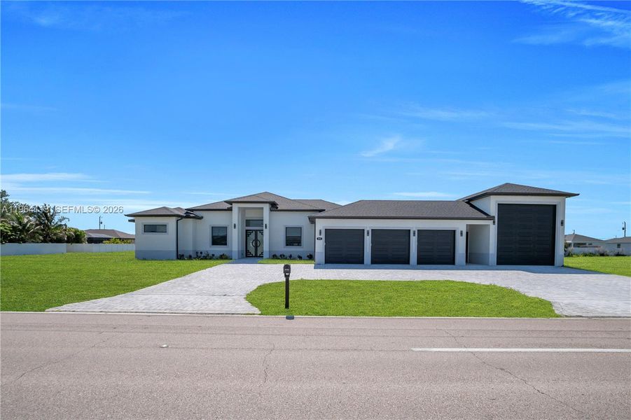 Front exterior of a new home in , Cape Coral, FL, highlighting curb appeal (Image 23).