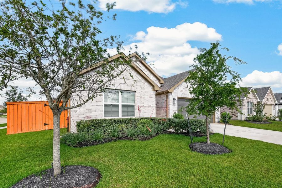 Front exterior of a new home in Marvida, Cypress, TX, highlighting curb appeal (Image 24). Front exterior of a new home in Marvida, Cypress, TX, highlighting curb appeal (Image 24).