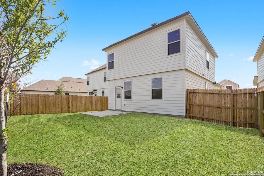 Front exterior of a new home in Blue Ridge Ranch, San Antonio, TX, highlighting curb appeal (Image 2). Front exterior of a new home in Blue Ridge Ranch, San Antonio, TX, highlighting curb appeal (Image 2).