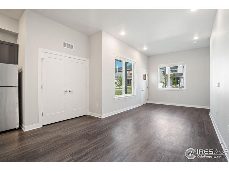 The laundry is conveniently located next to the living room.