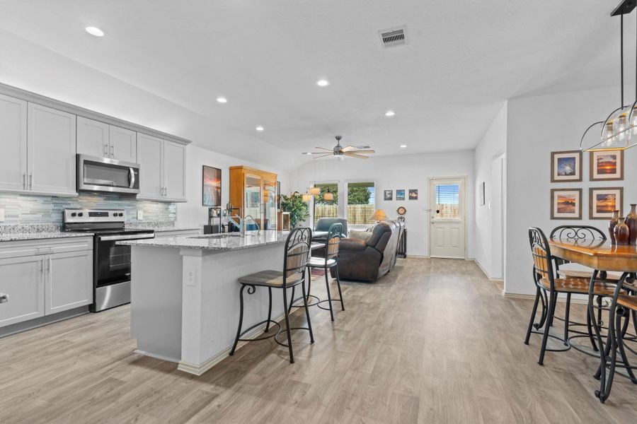 Wow! What a breathtaking open concept home! Looks like a model home! The gourmet kitchen steals the show with beautiful granite countertops, tall shaker cabinets for plenty of storage, stainless steel appliances, and a large eat-in & working island perfect for meal prep or gathering with friends and family. The gourmet kitchen flows into the family room and dining area makes entertaining effortless and everyday living a joy. Wow! What a breathtaking open concept home! Looks like a model home! The gourmet kitchen steals the show with beautiful granite countertops, tall shaker cabinets for plenty of storage, stainless steel appliances, and a large eat-in & working island perfect for meal prep or gathering with friends and family. The gourmet kitchen flows into the family room and dining area makes entertaining effortless and everyday living a joy.