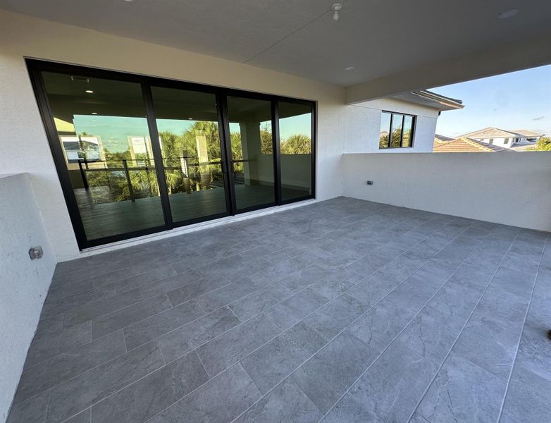 Exterior details and patio area of a home in Coral Isles at Avenir, Palm Beach Gardens (Image 2).