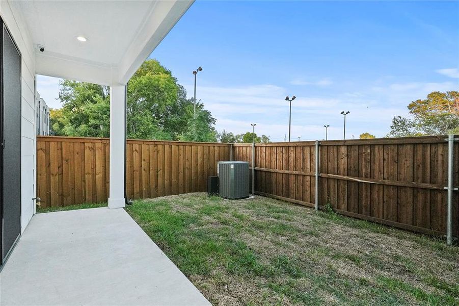 View of yard featuring cooling unit