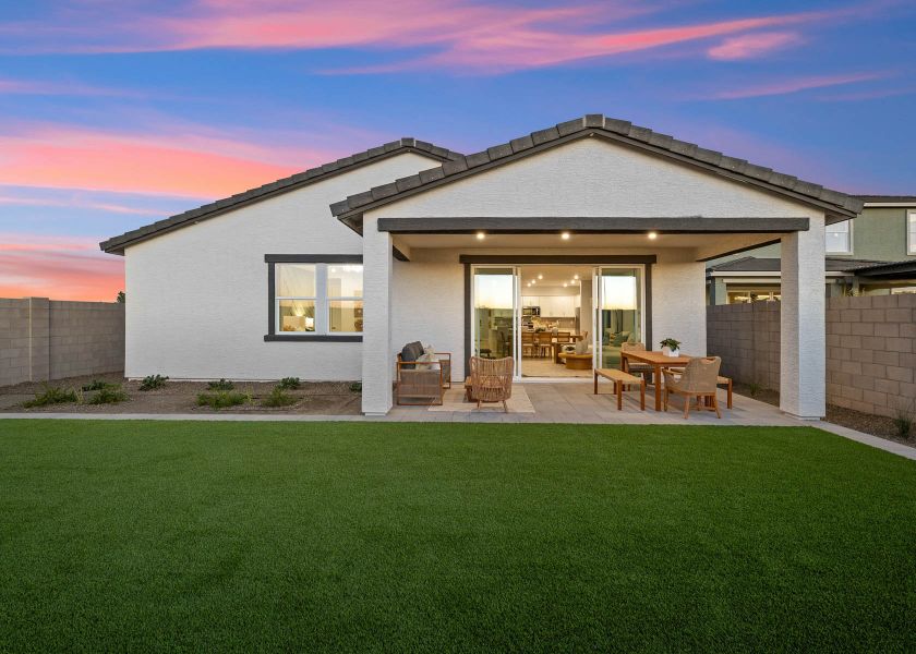 A house with a lawn and chairs. A house with a lawn and chairs.