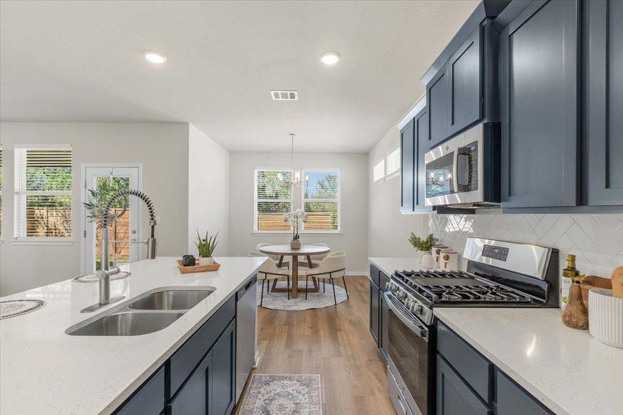 The kitchen effortlessly flows into the dining area.