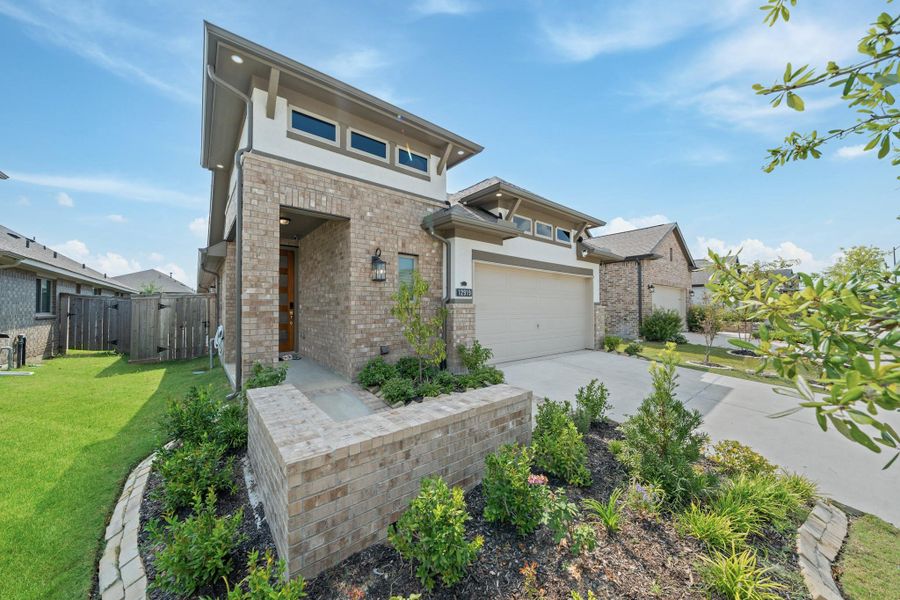 Front exterior of a new home in , Cypress, TX, highlighting curb appeal (Image 2).